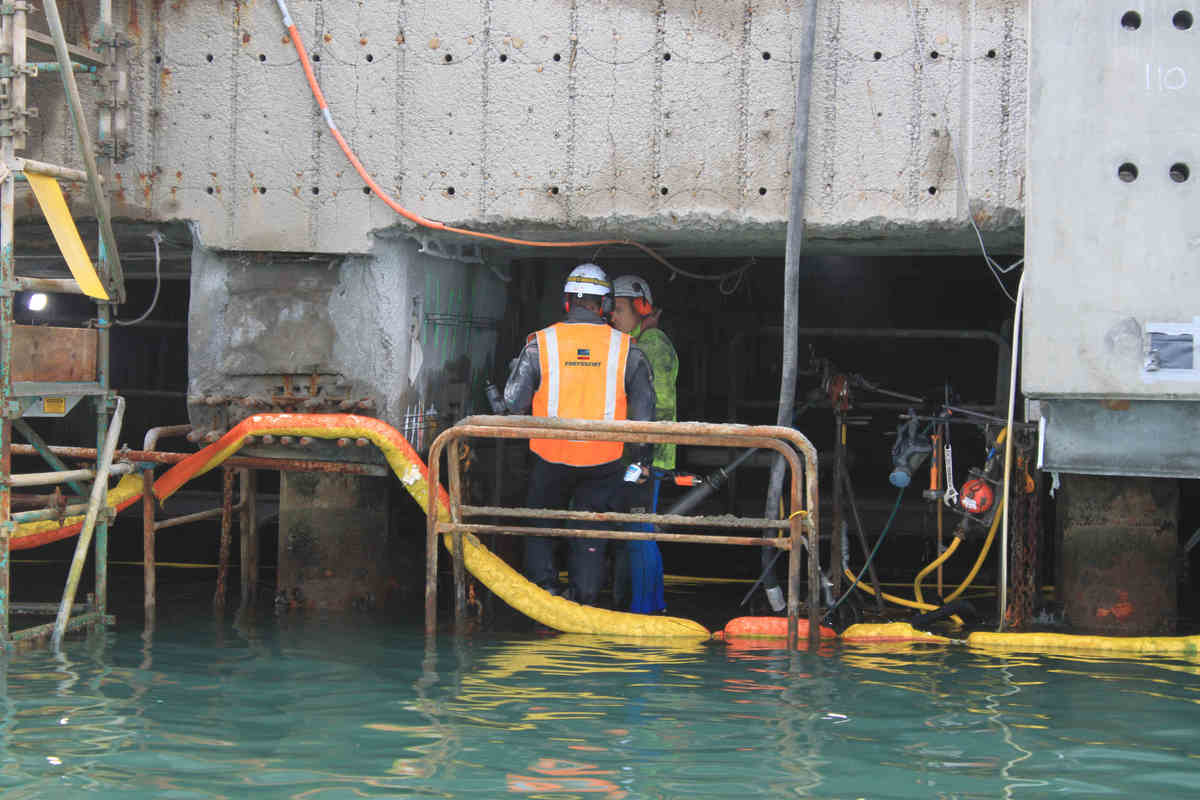 Dock restoration with cathodic protection and containment lining